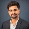 L Ajay