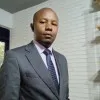 JOHN MUNIU