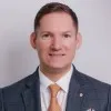 Derek Rostel FCIPD FIH